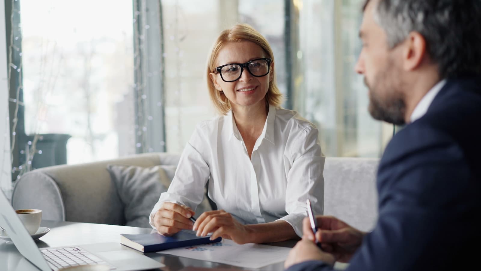 Attorney walking a client through their hearing prep packet